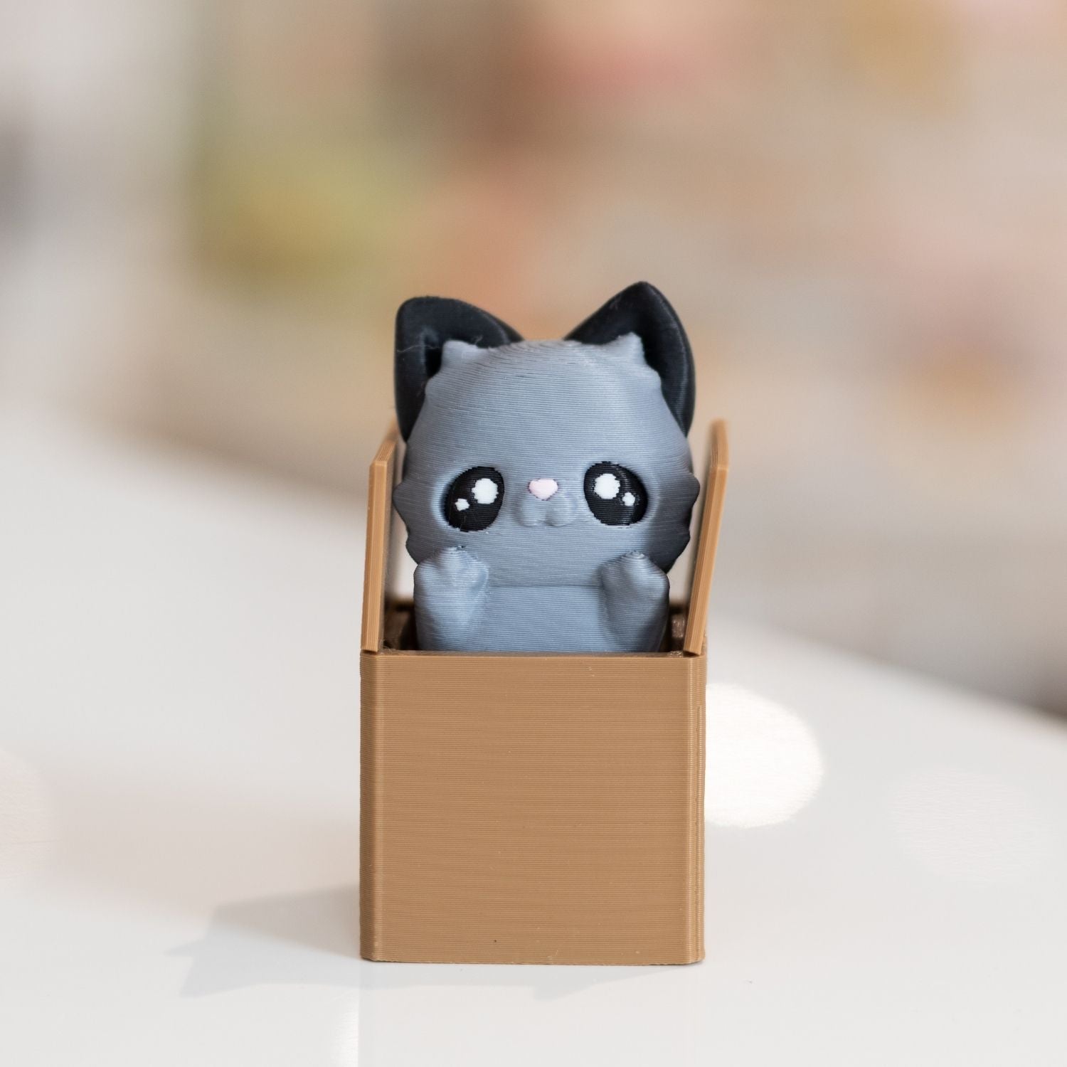 Clicker fidget TDAH chat dans carton kawaii imprimée en 3D à Cognac