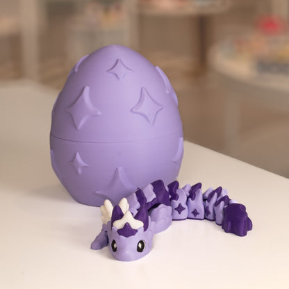 Figurine bébé dragon 3D mauve avec son œuf. Modèle kawaii imprimé en 3D à Cognac.