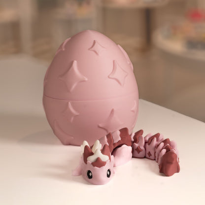 Figurine bébé dragon 3D rose avec son œuf. Modèle kawaii imprimé en 3D à Cognac.