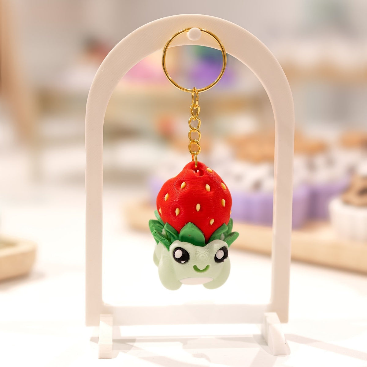 Porte-clé pgrenouille kawaii fraise clicker fidget anti-stress. Imprimé en 3D à Cognac